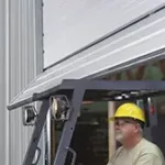 Break-away bottom section on a Clopay Energy Series commercial door