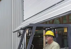 Break-away bottom section on a Clopay Energy Series commercial door