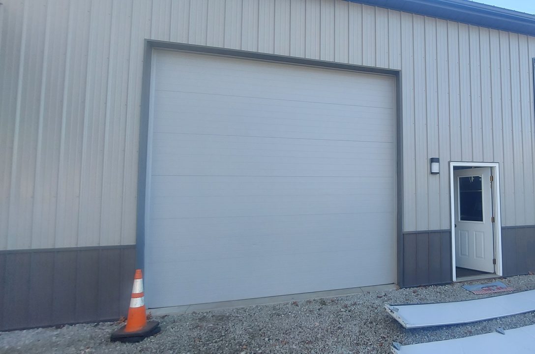 Commercial overhead sectional door serviced by Proactive Garage Door Repair