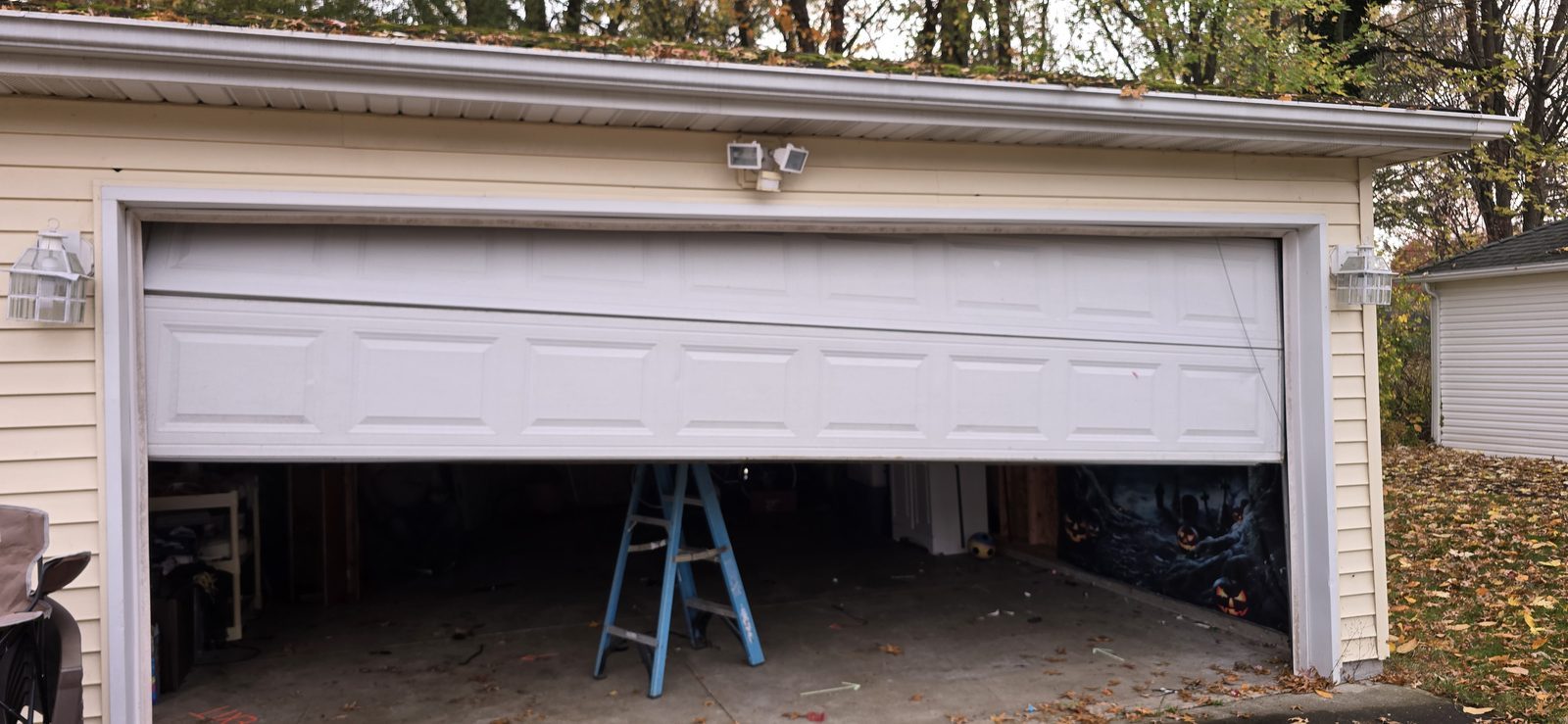 Damaged garage door before repair, photo 2