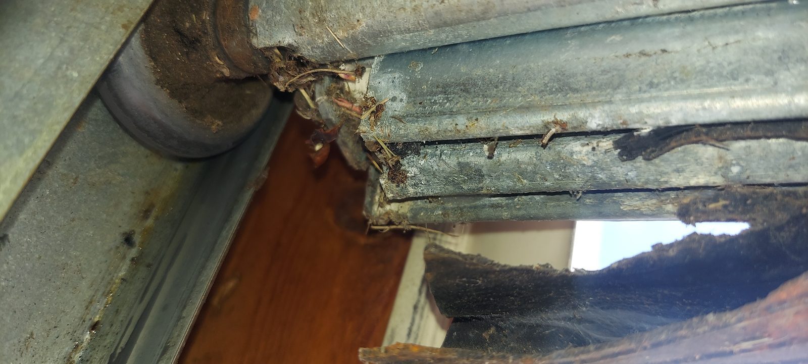 Damaged garage door before repair, photo 2