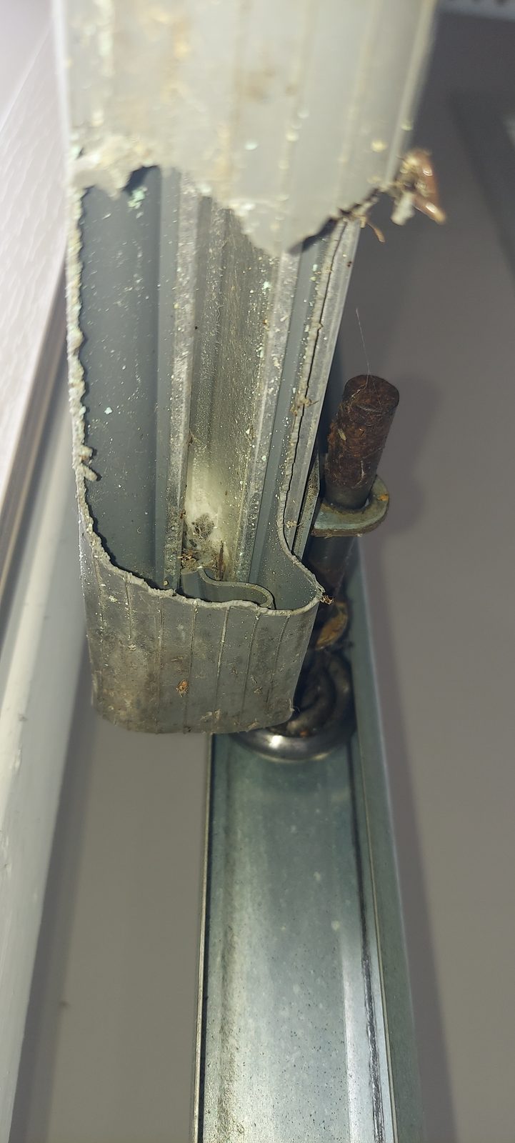Damaged garage door before repair, photo 4