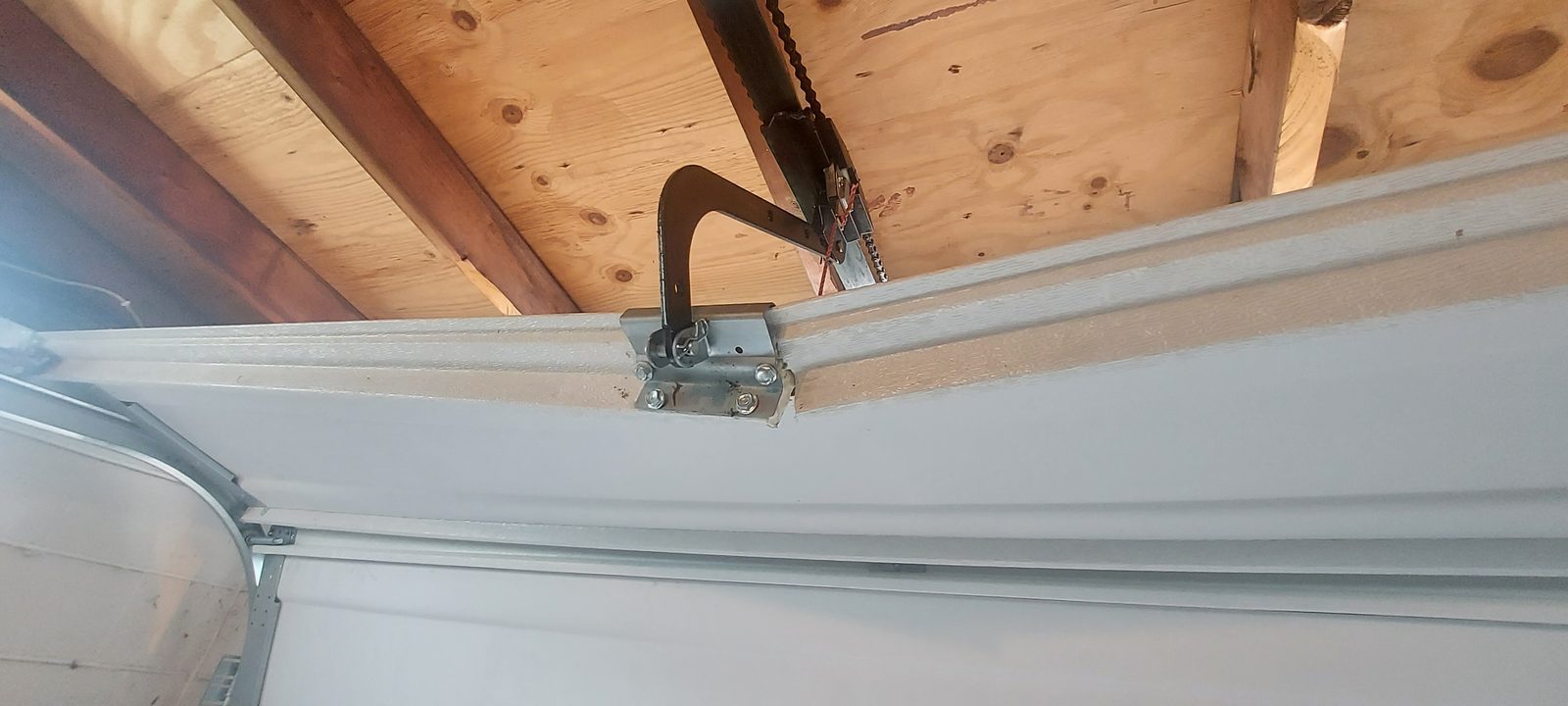 Damaged garage door before repair, photo 2