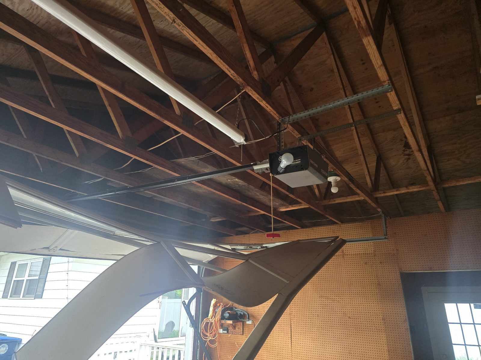 Damaged garage door before repair