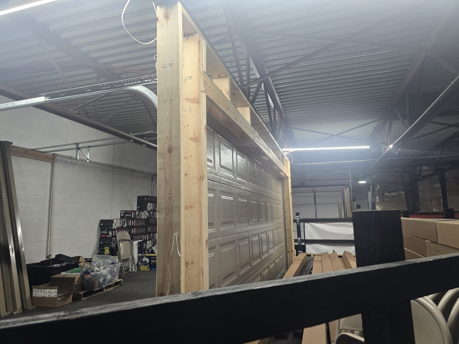 Garage door sections and parts stored in a warehouse