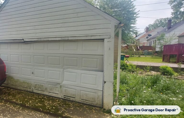 Damaged garage door before repair, photo 3