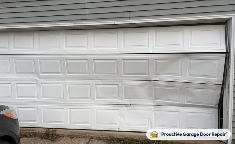 Damaged garage door before repair