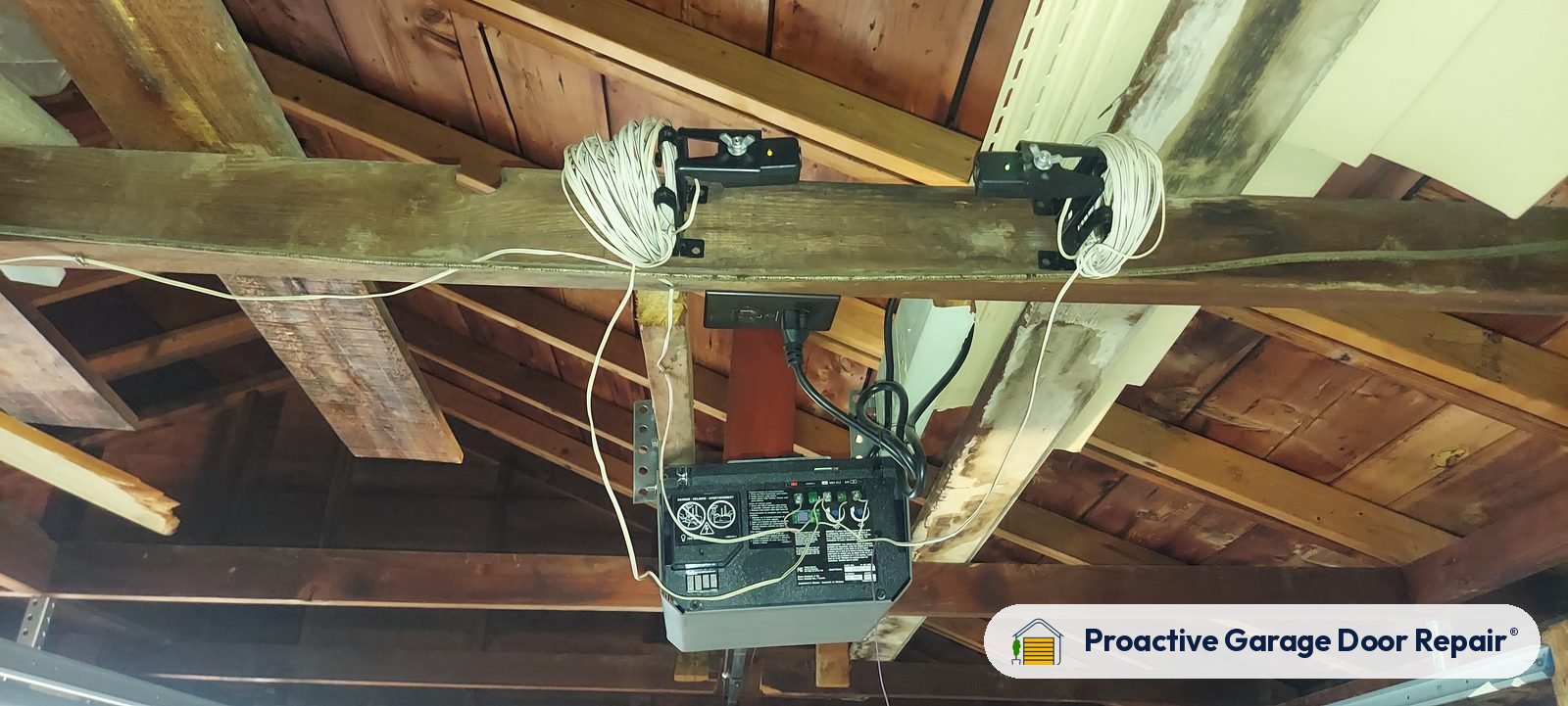Garage door opener and rail in a customer garage, Proactive Garage Door Repair job, photo 2