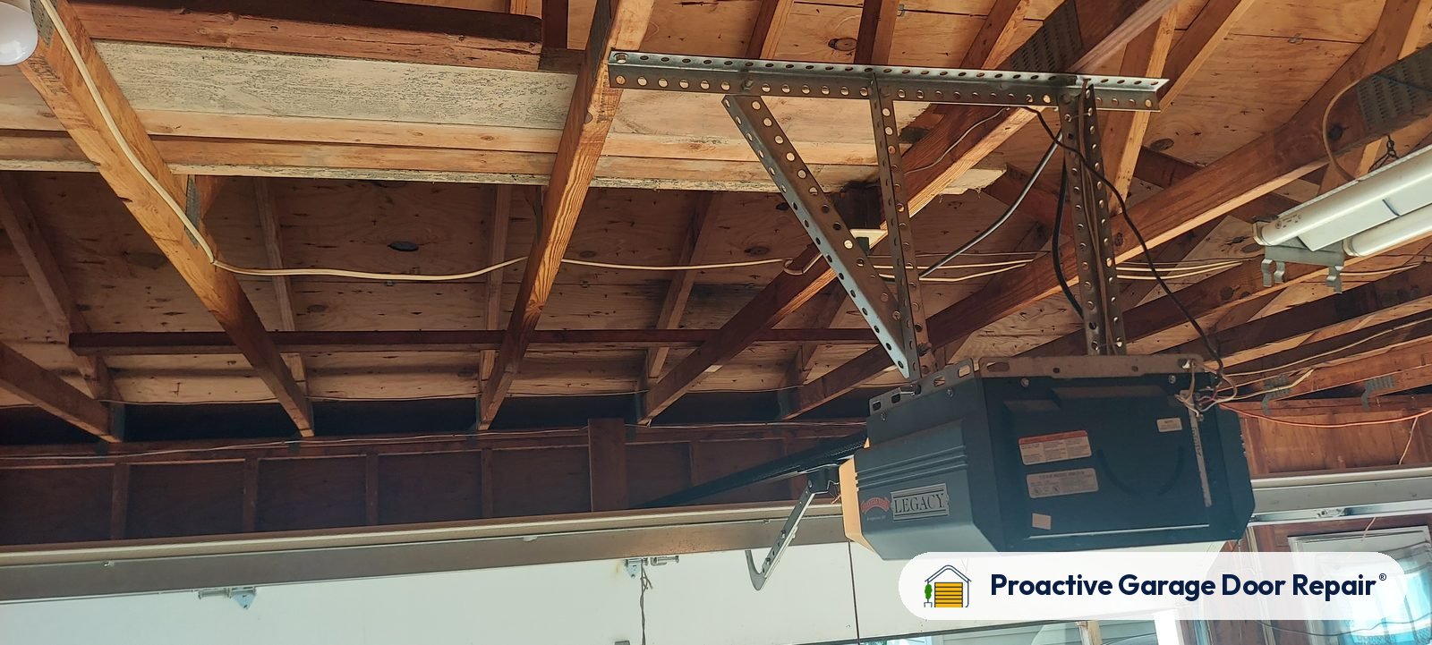 Garage door opener and rail in a customer garage, Proactive Garage Door Repair job, photo 2