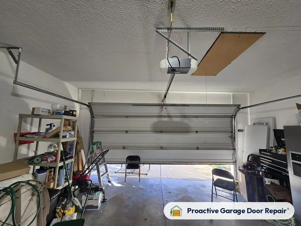 Garage door opener and rail in a customer garage, Proactive Garage Door Repair job