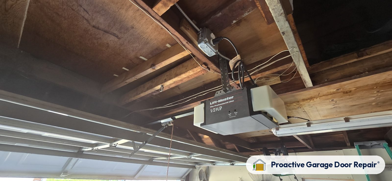 Garage door opener and rail in a customer garage, Proactive Garage Door Repair job
