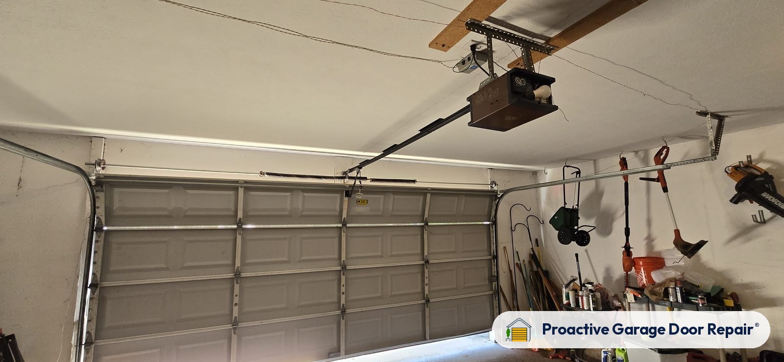 Garage door opener and rail in a customer garage, Proactive Garage Door Repair job