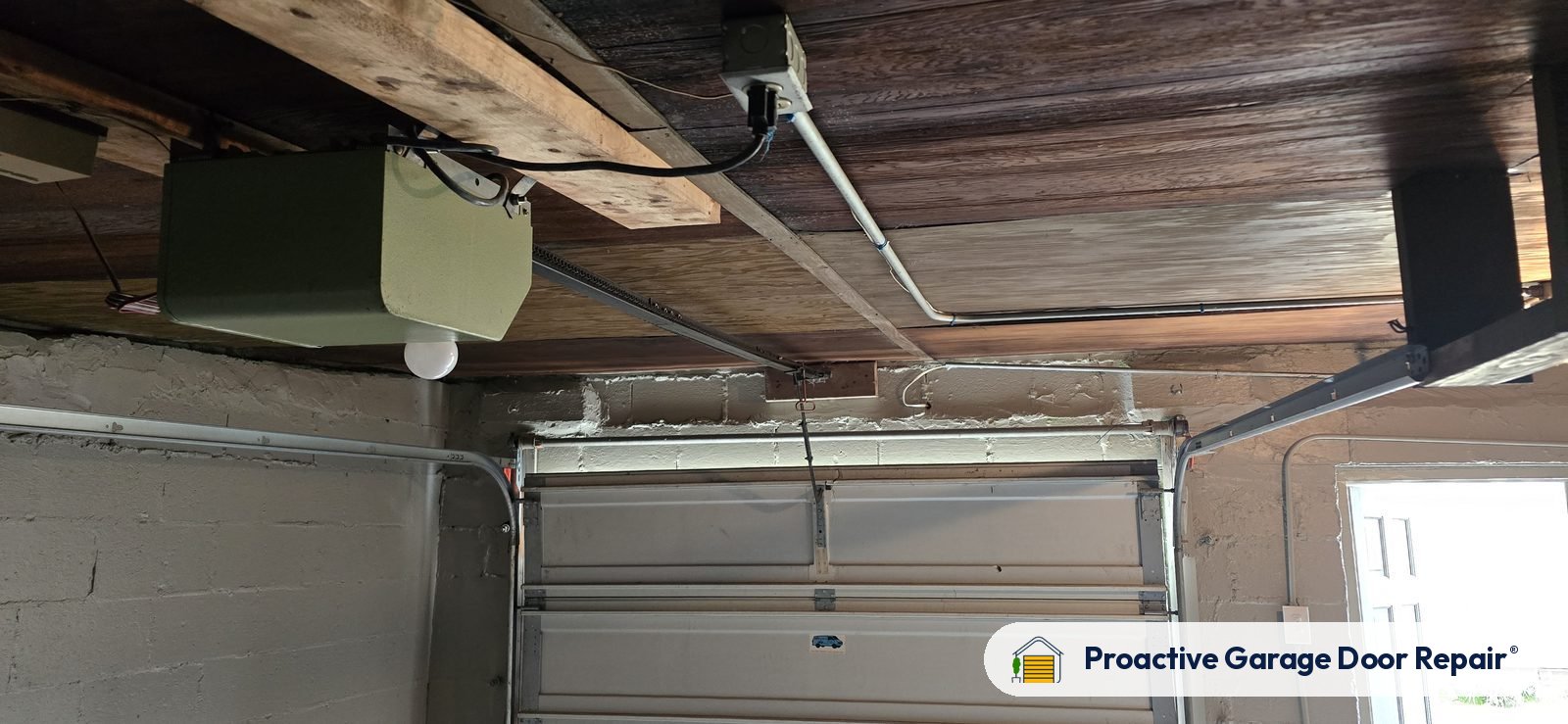 Garage door opener and rail in a customer garage, Proactive Garage Door Repair job