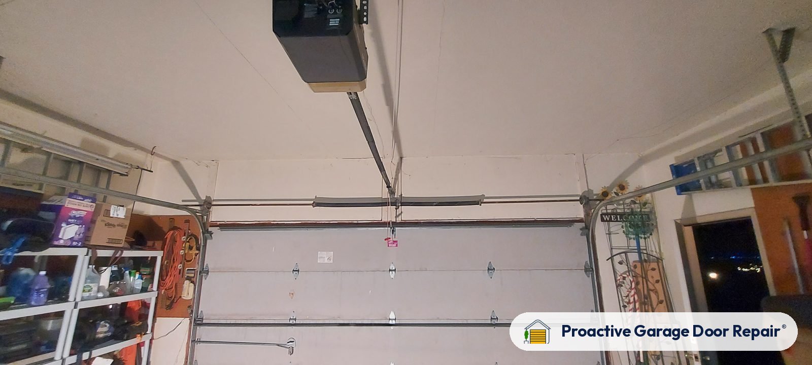 Garage door opener and rail in a customer garage, Proactive Garage Door Repair job, photo 2
