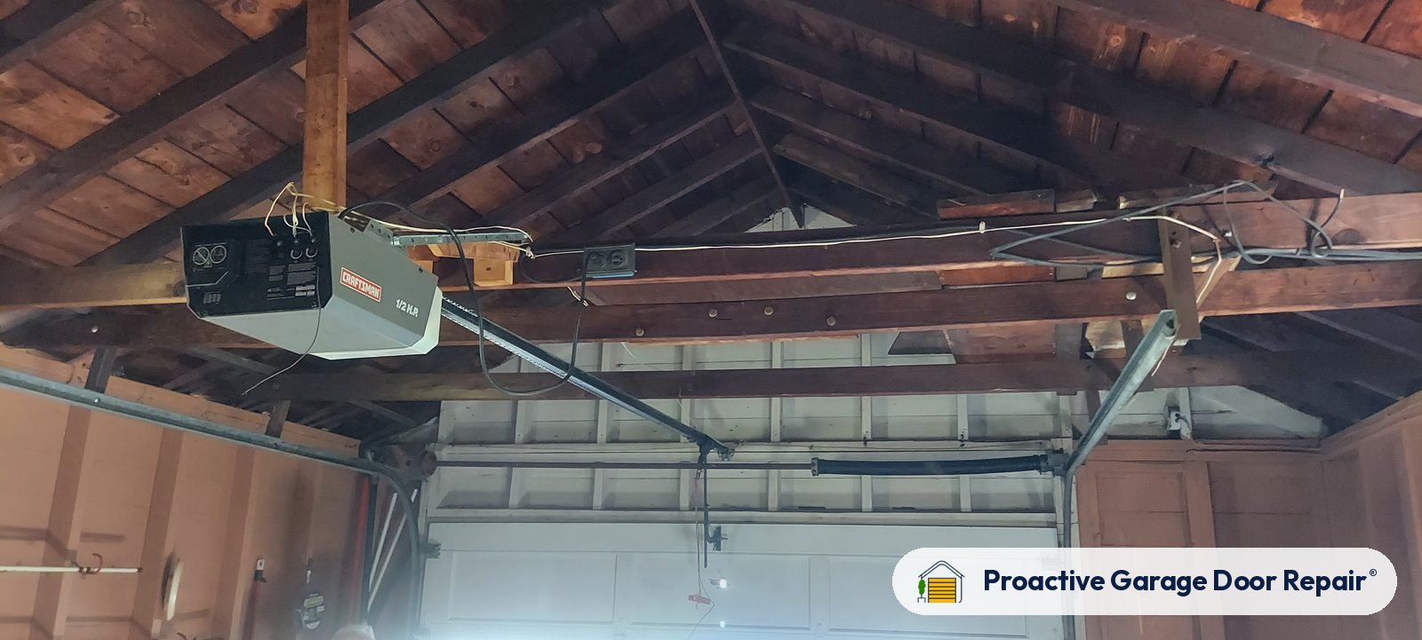 Garage door opener and rail in a customer garage, Proactive Garage Door Repair job