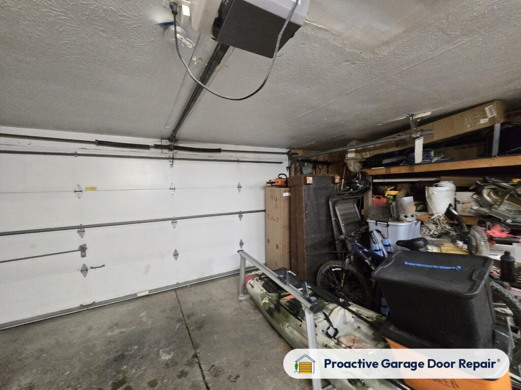 Garage door opener and rail in a customer garage, Proactive Garage Door Repair job