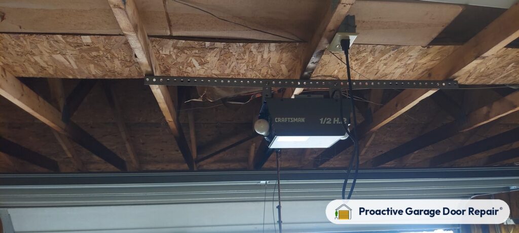 Garage door opener and rail in a customer garage, Proactive Garage Door Repair job