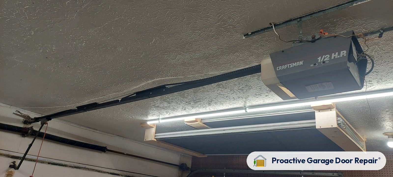 Garage door opener and rail in a customer garage, Proactive Garage Door Repair job