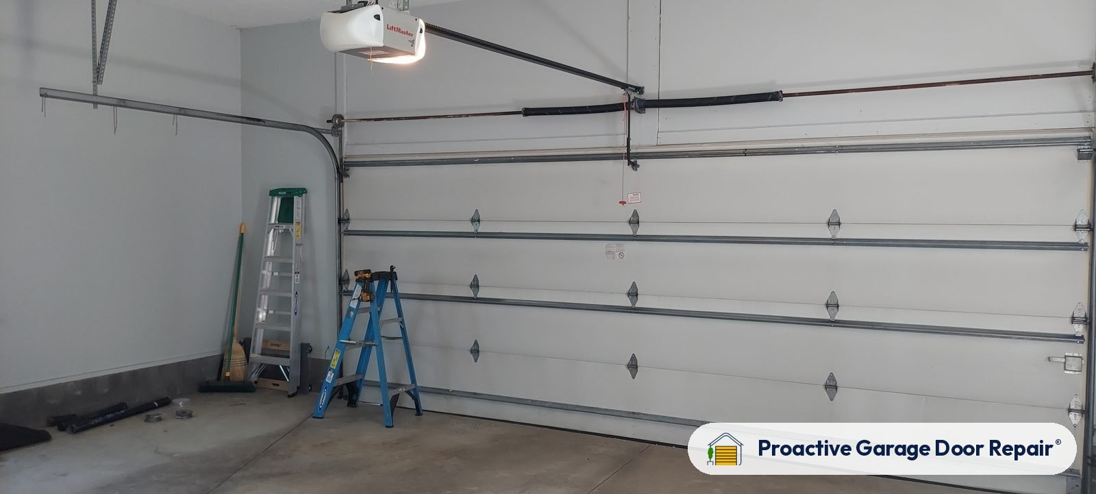 Garage door opener and rail in a customer garage, Proactive Garage Door Repair job