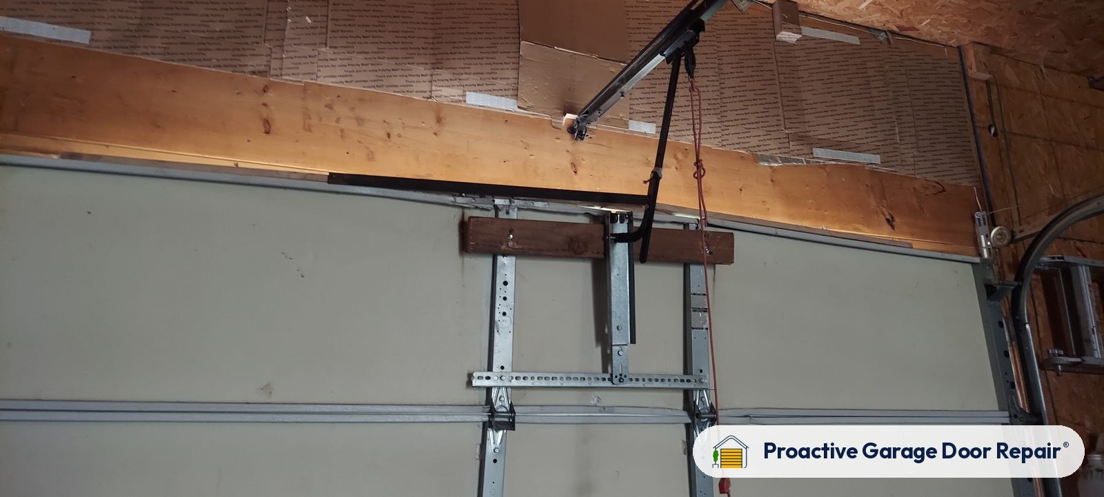 Garage door opener and rail in a customer garage, Proactive Garage Door Repair job