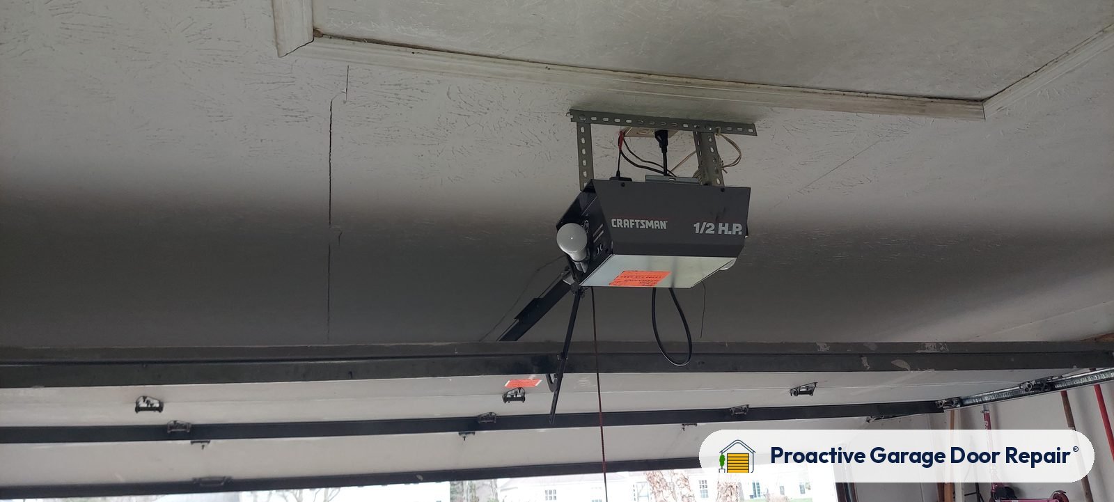 Garage door opener and rail in a customer garage, Proactive Garage Door Repair job