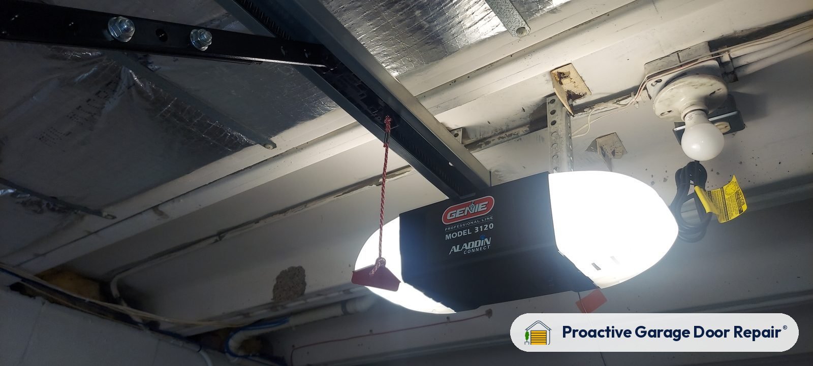 Garage door opener and rail in a customer garage, Proactive Garage Door Repair job
