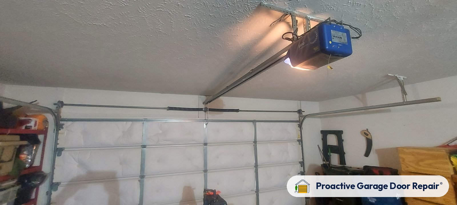Garage door opener and rail in a customer garage, Proactive Garage Door Repair job