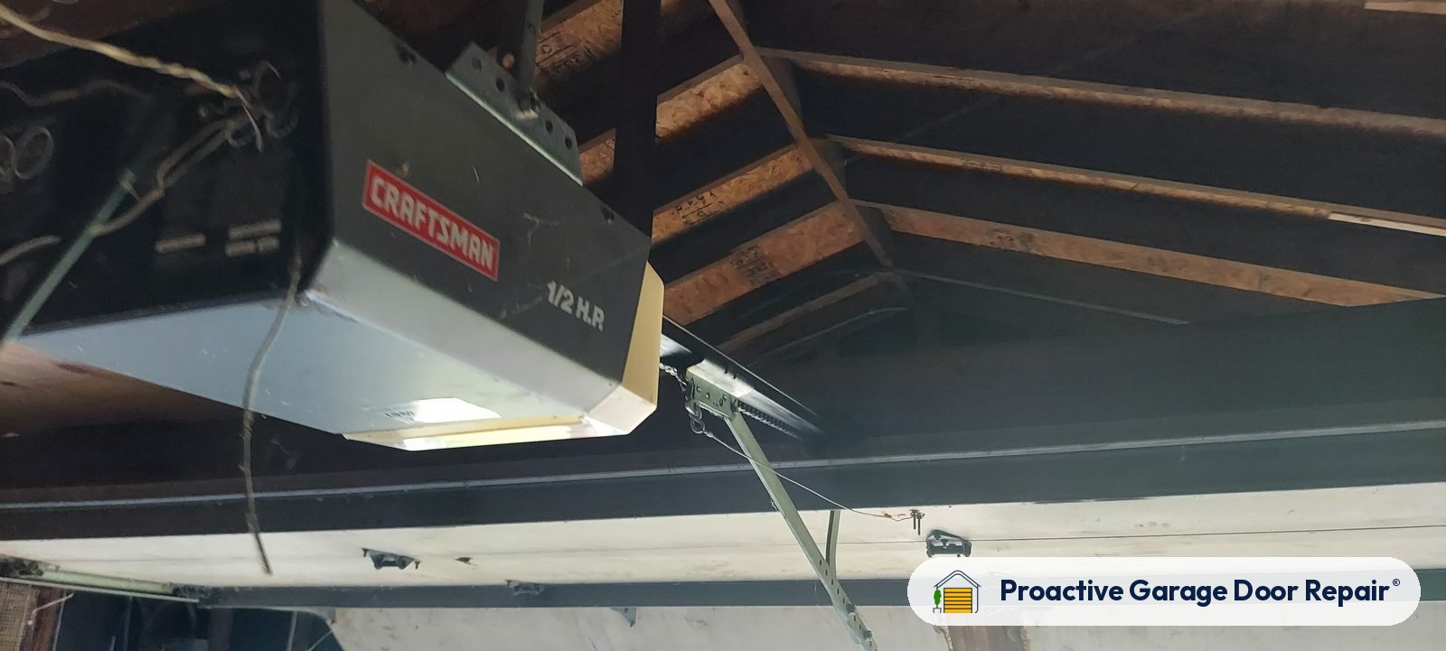 Garage door opener and rail in a customer garage, Proactive Garage Door Repair job