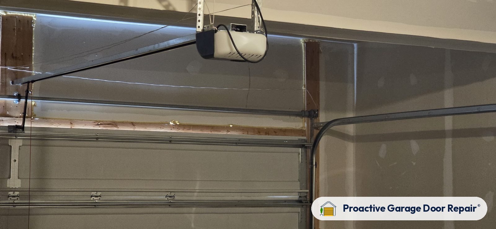 Garage door opener and rail in a customer garage, Proactive Garage Door Repair job