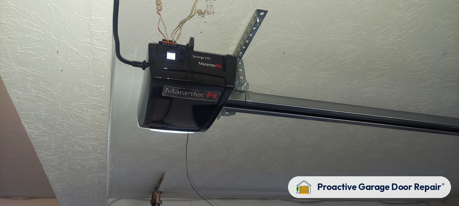 Garage door opener and rail in a customer garage, Proactive Garage Door Repair job