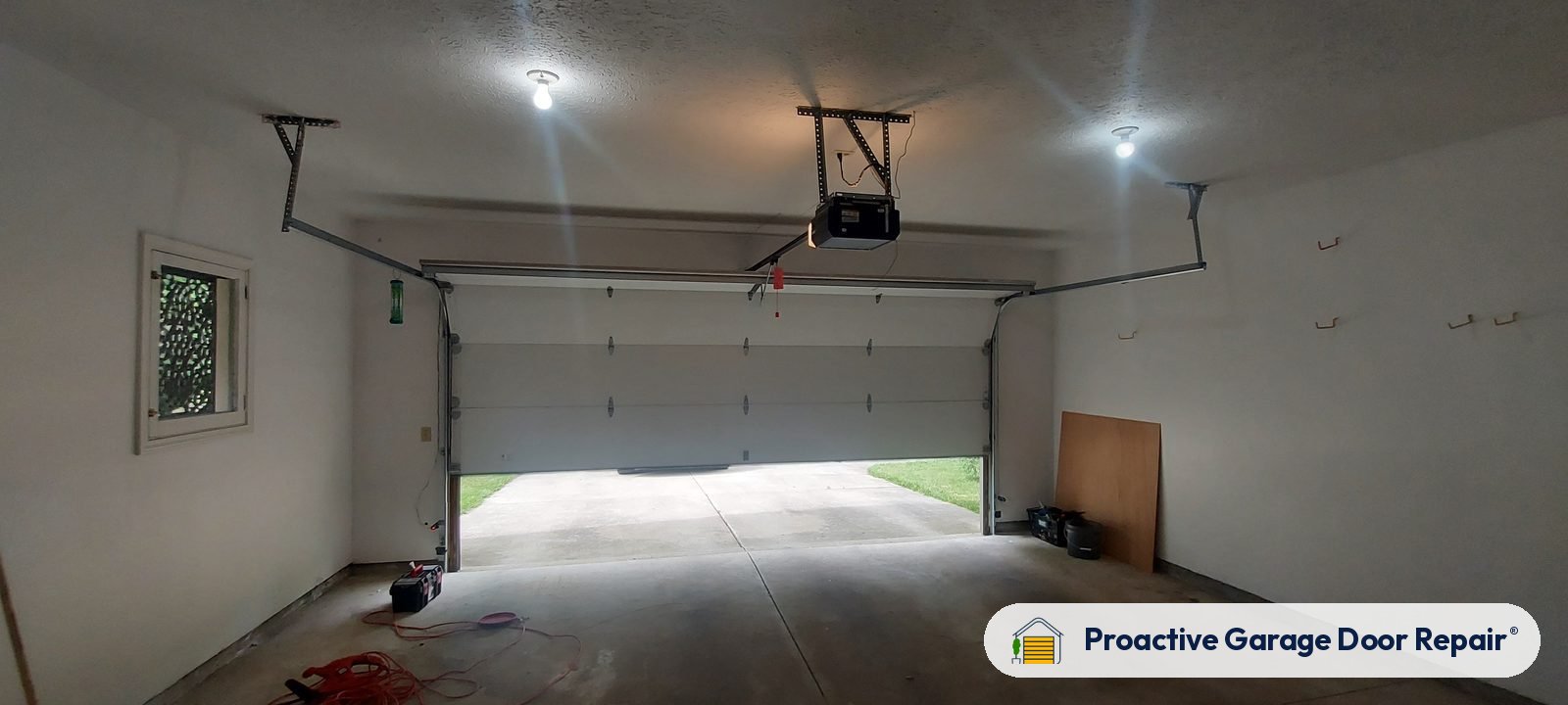 Garage door opener and rail in a customer garage, Proactive Garage Door Repair job