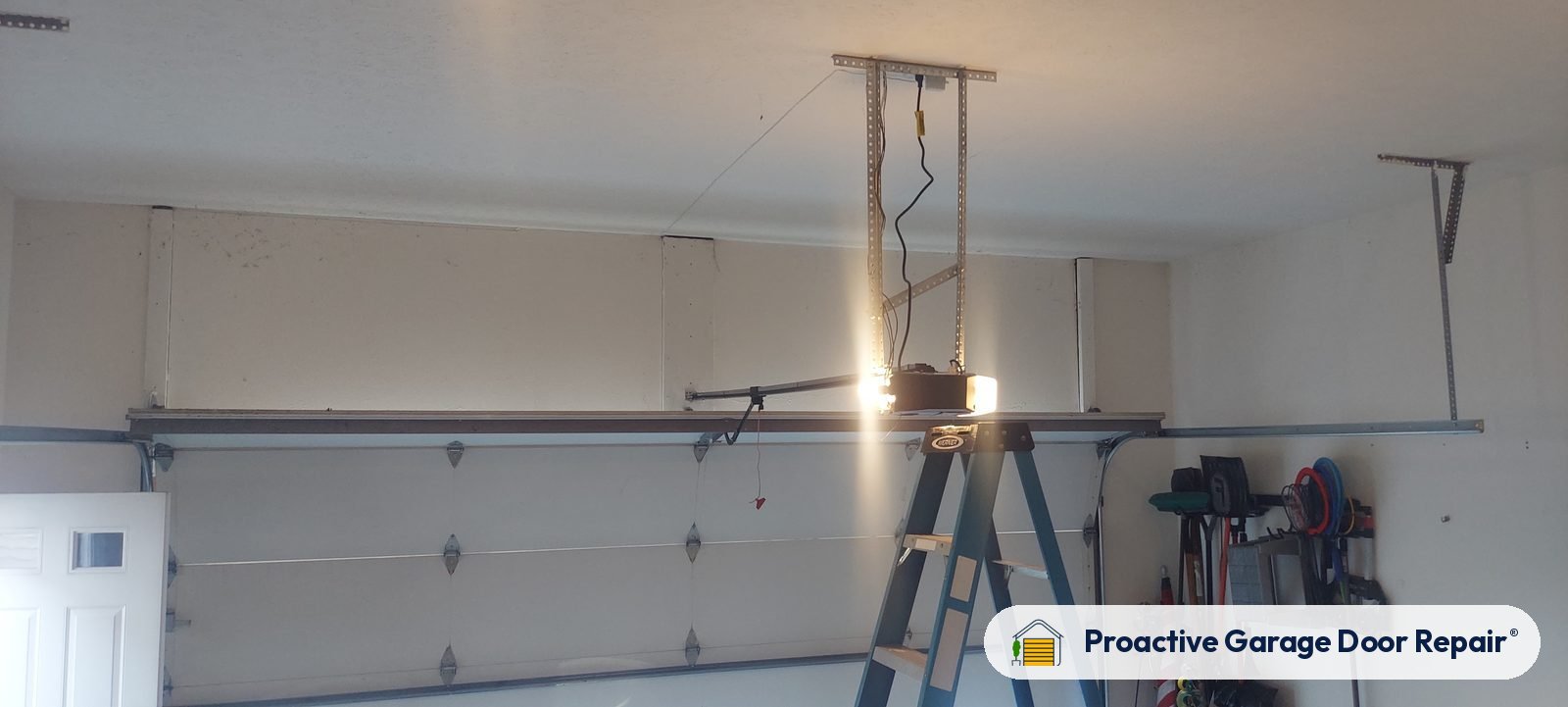 Garage door opener and rail in a customer garage, Proactive Garage Door Repair job, photo 2