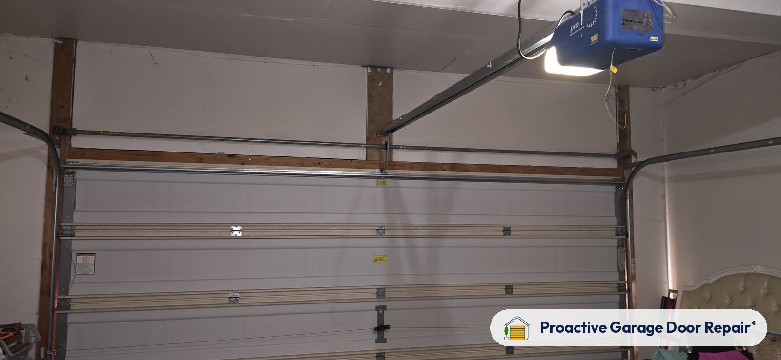 Garage door opener and rail in a customer garage, Proactive Garage Door Repair job, photo 2
