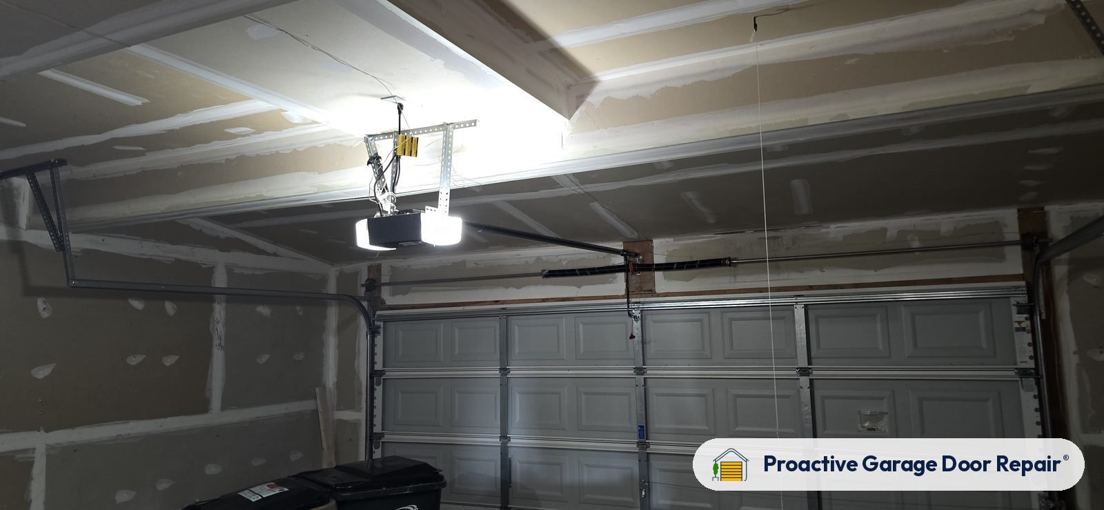 Garage door opener and rail in a customer garage, Proactive Garage Door Repair job