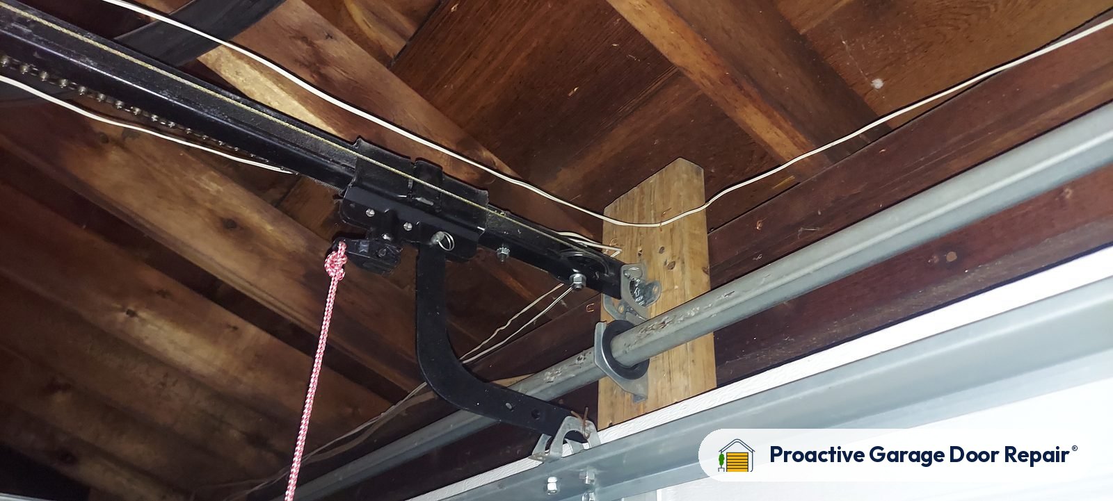Garage door opener and rail in a customer garage, Proactive Garage Door Repair job