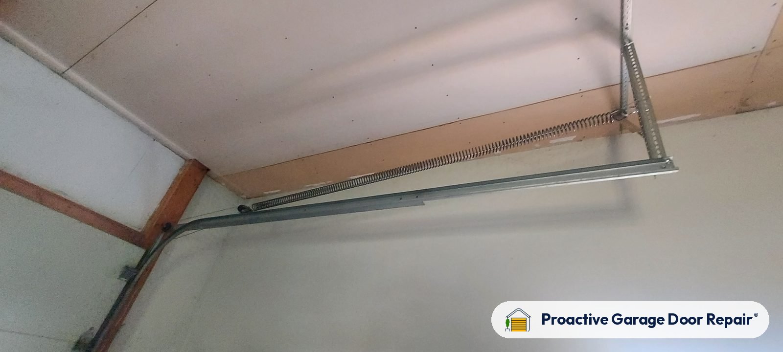 Garage door opener and rail in a customer garage, Proactive Garage Door Repair job in Massillon, Ohio