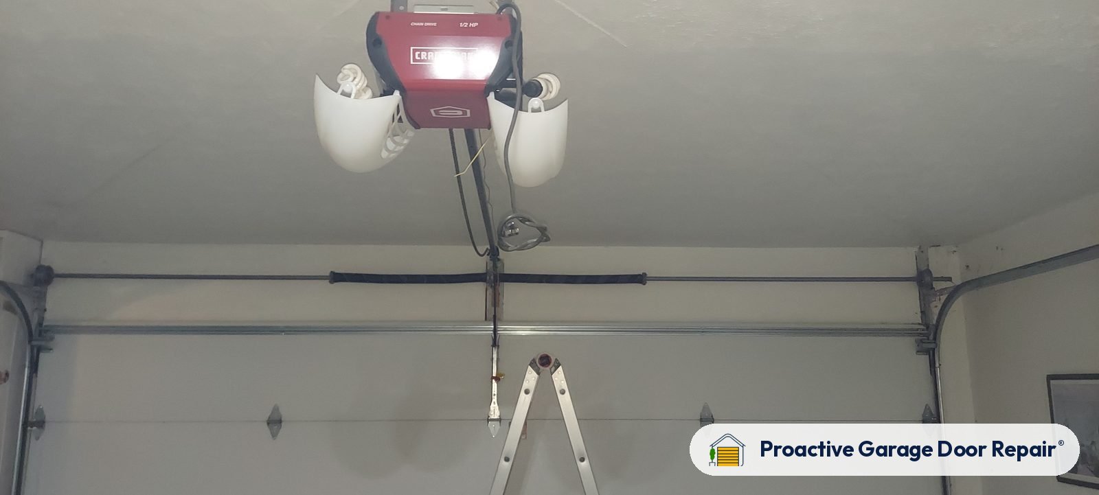 Garage door opener and rail in a customer garage, Proactive Garage Door Repair job in North Olmsted, Ohio, photo 2