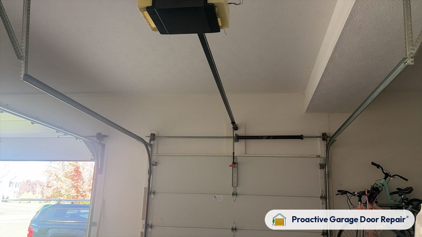 Garage door opener and rail inside a garage