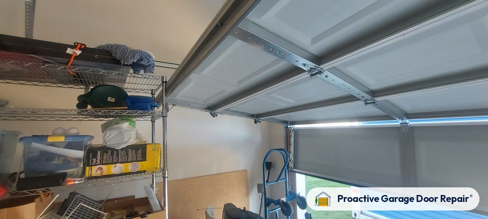 Garage door track and panels inside a garage